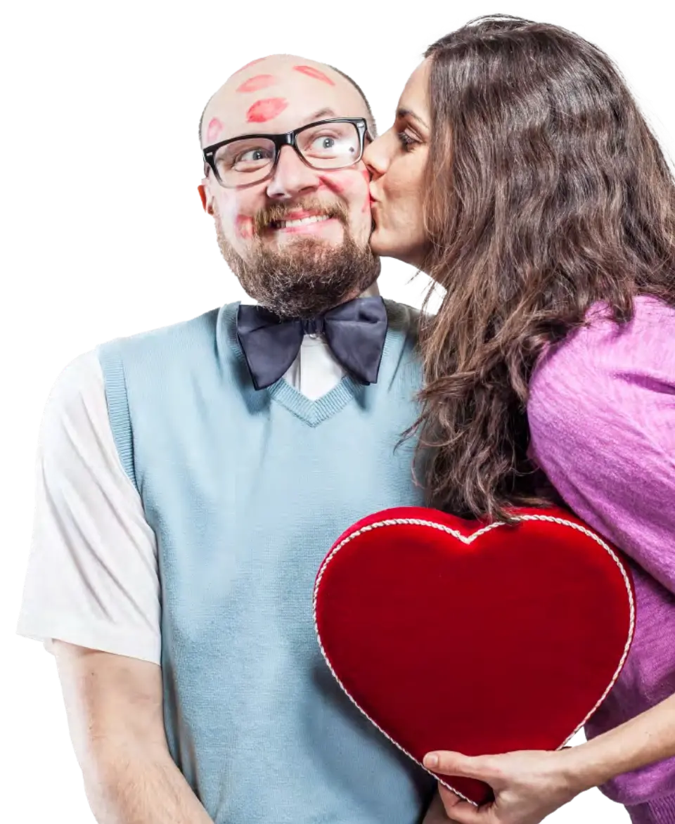 Photo of a woman kissing a man on his cheek